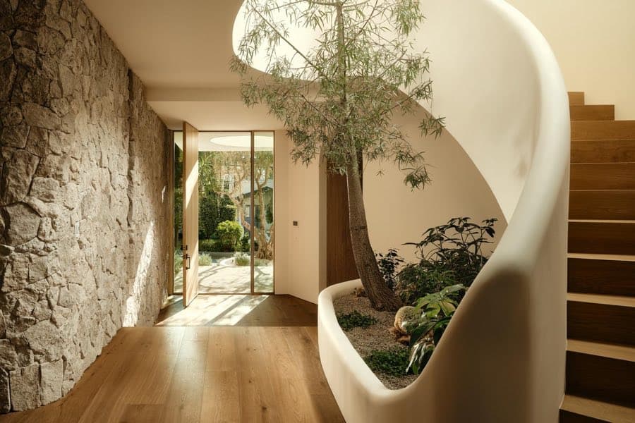 Spiral stair and indoor tree at Goodland Blanc