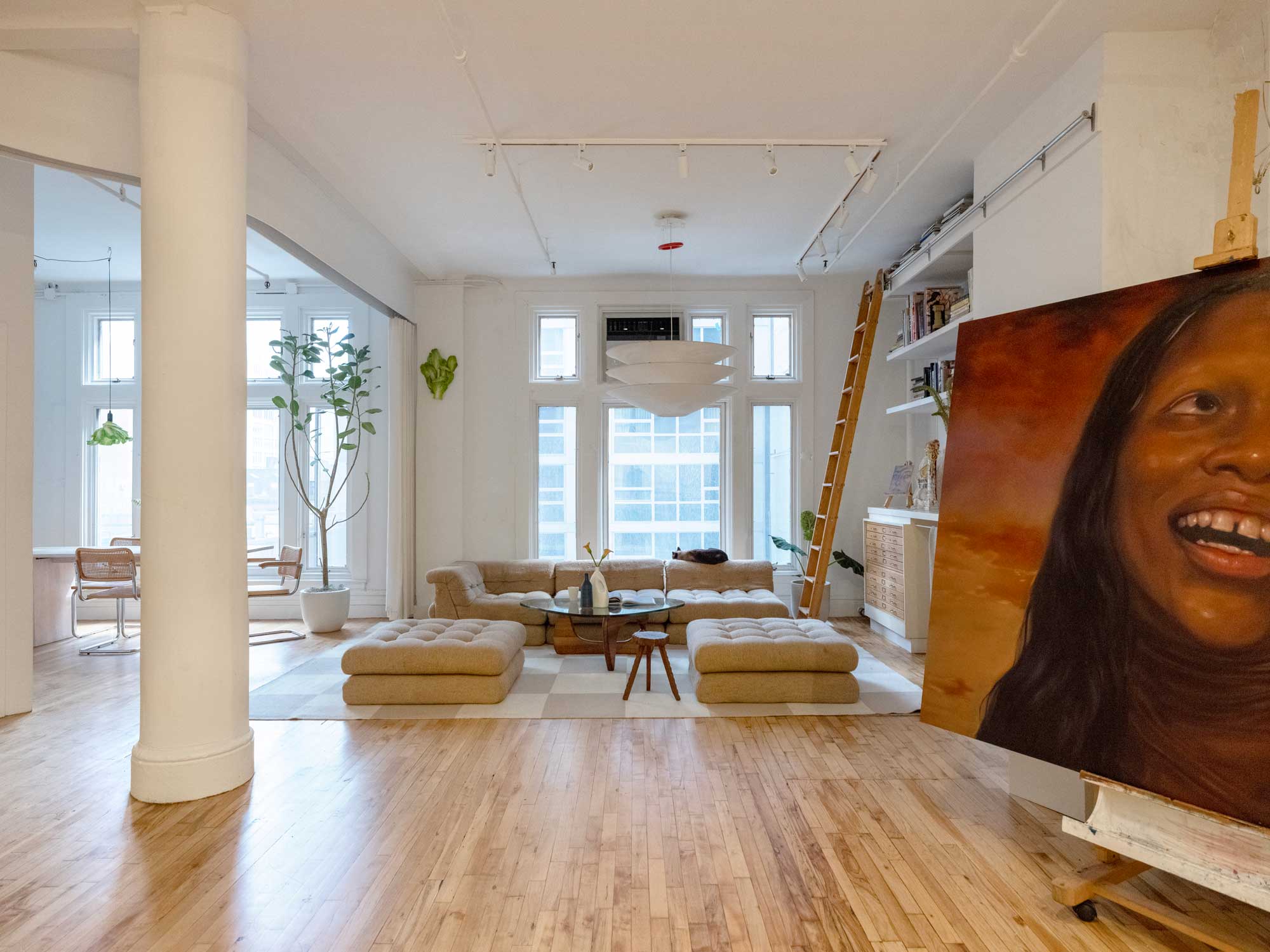 witness locations wise loft nomad manhattan living room columns portrait canvas sofas