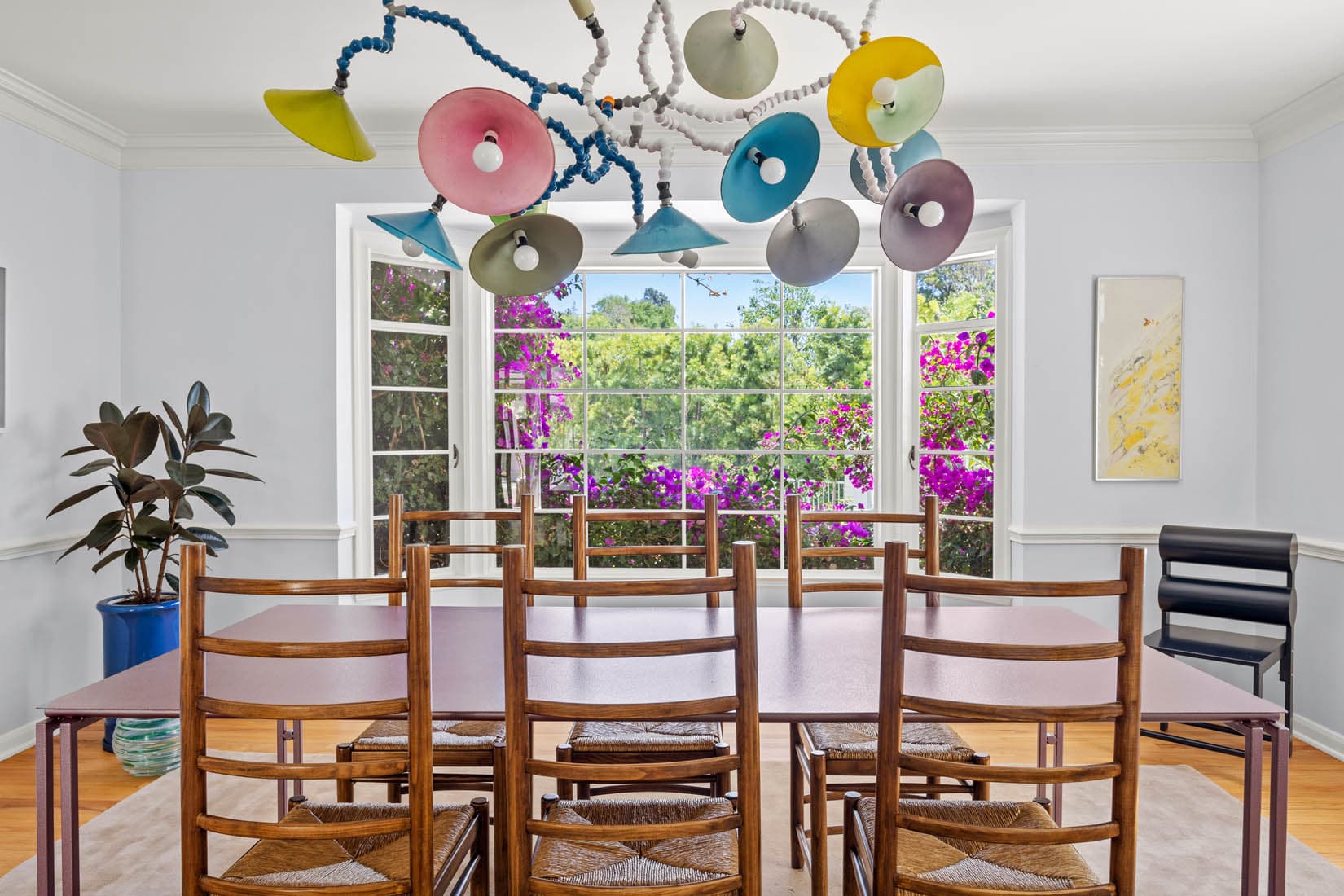 witness locations frost house los feliz los angeles dining room glass disc chandelier ladderback chairs