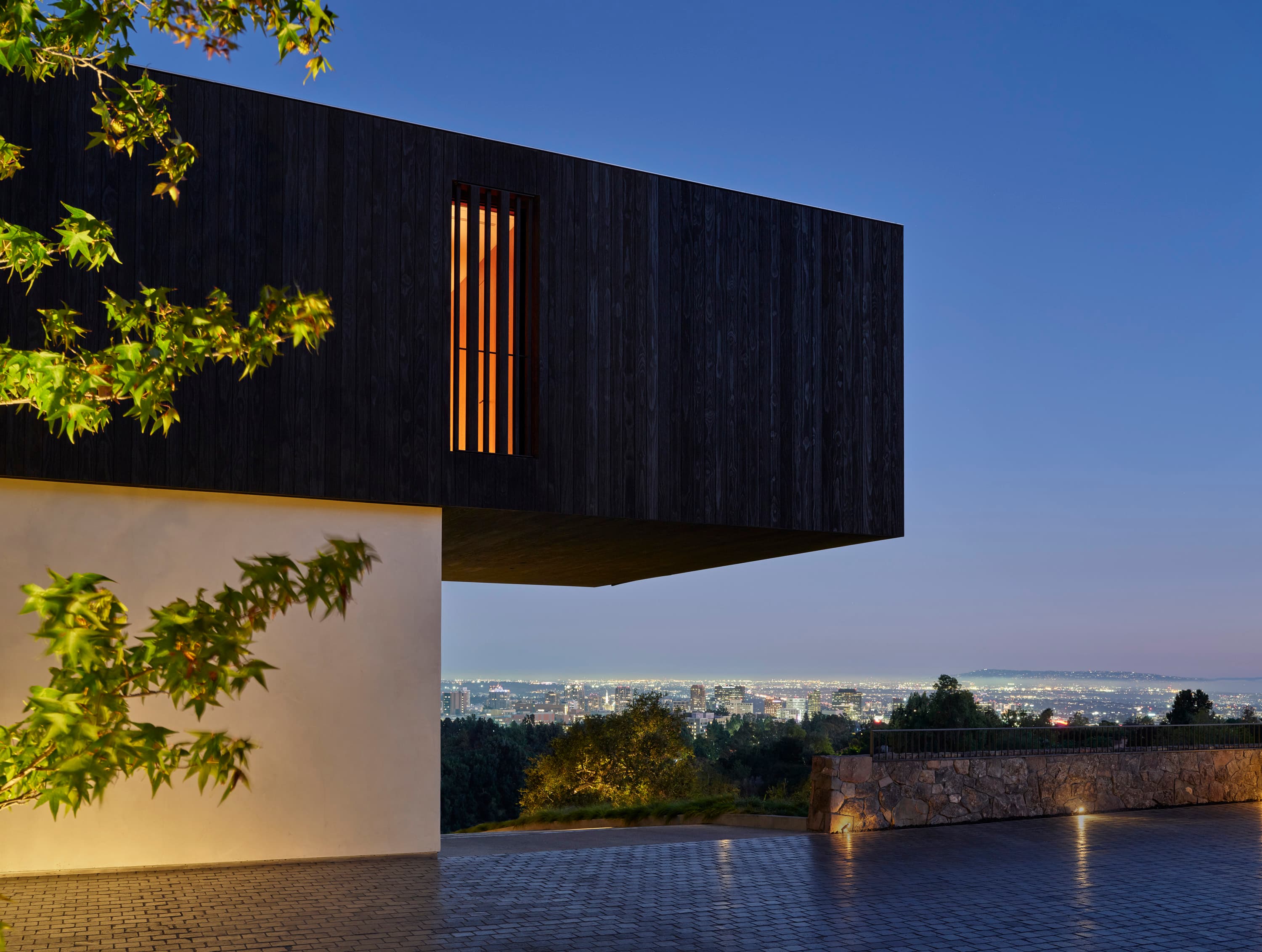 witness locations strata house bel air los angeles exterior cantilevered black volume dusk city view
