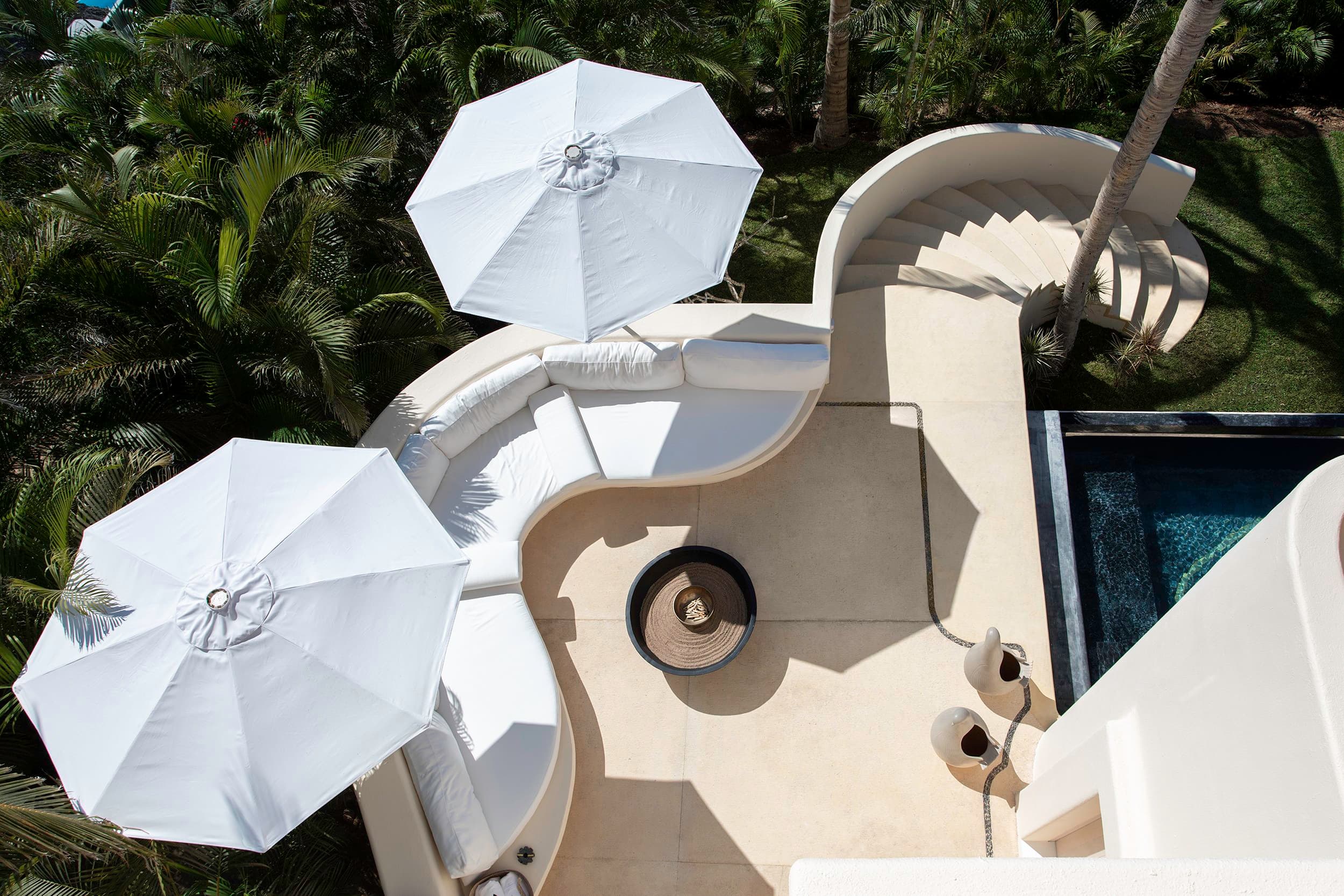 witness locations casa la huerta costa careyes jalisco terrace white umbrellas sculptural plaster jungle