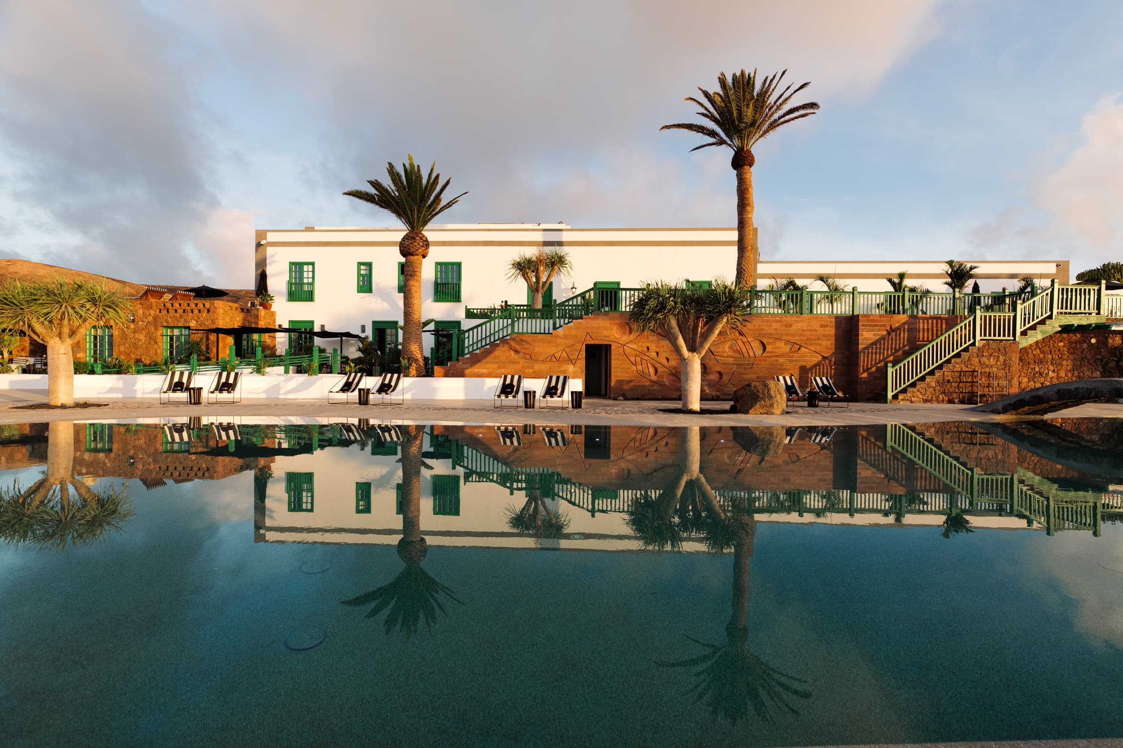 witness locations cesar lanzarote spain pool reflection palms white facade