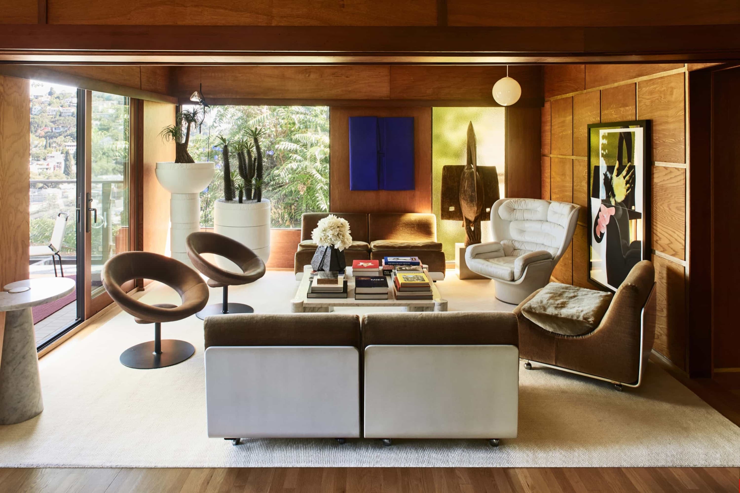 witness locations milano house silver lake los angeles living room wood paneling white sofas blue art