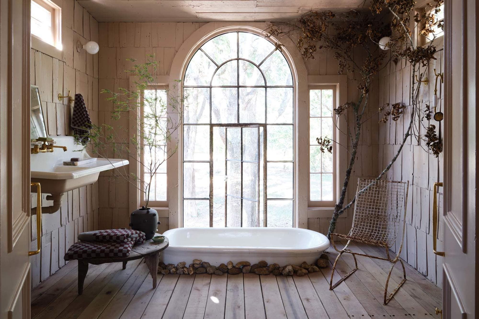 witness locations leftovers farmhouse round top texas bathroom arched window clawfoot tub dried branches