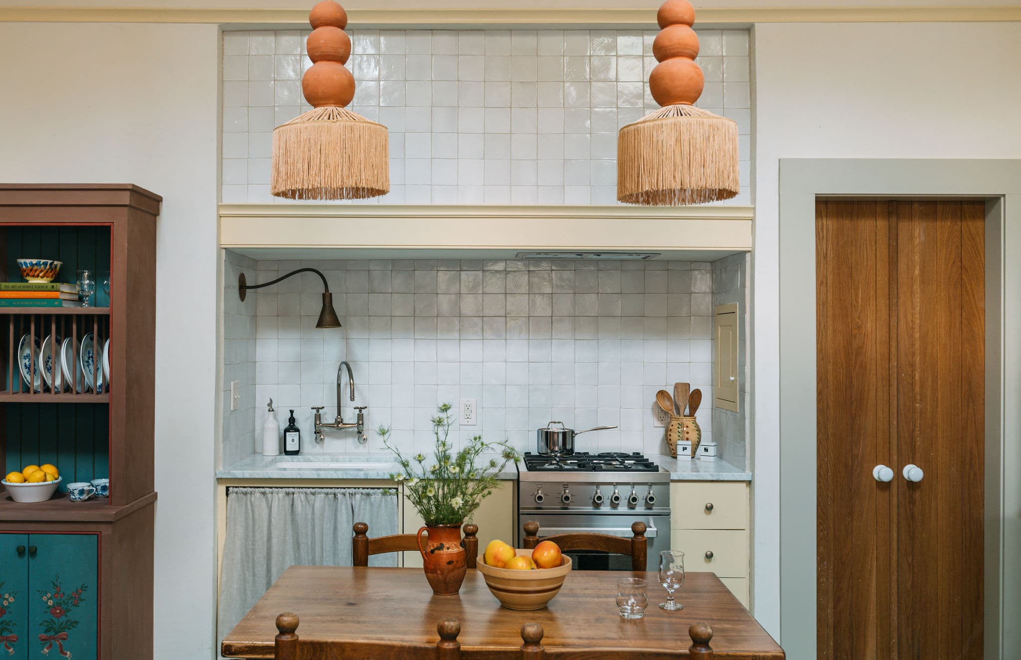 witness locations maison du conte bywater new orleans kitchen dining table rattan pendants white tile