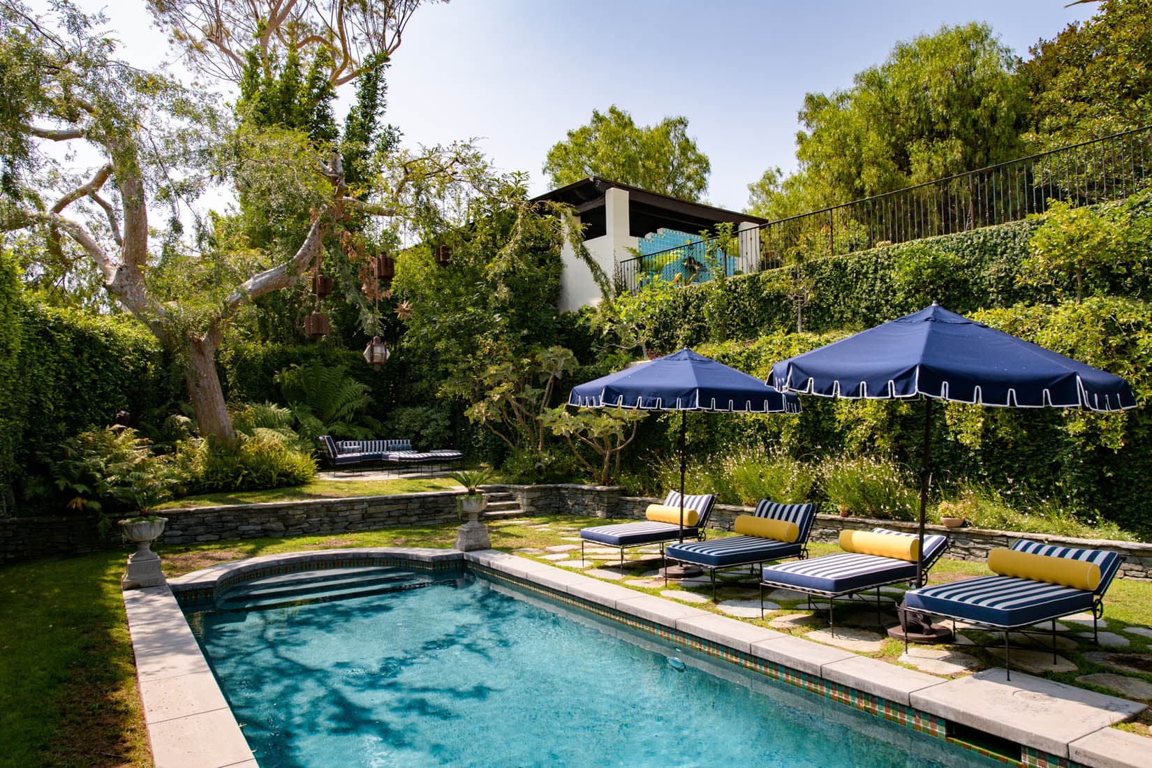 witness locations kings road estate hollywood hills los angeles pool blue umbrellas terraced garden