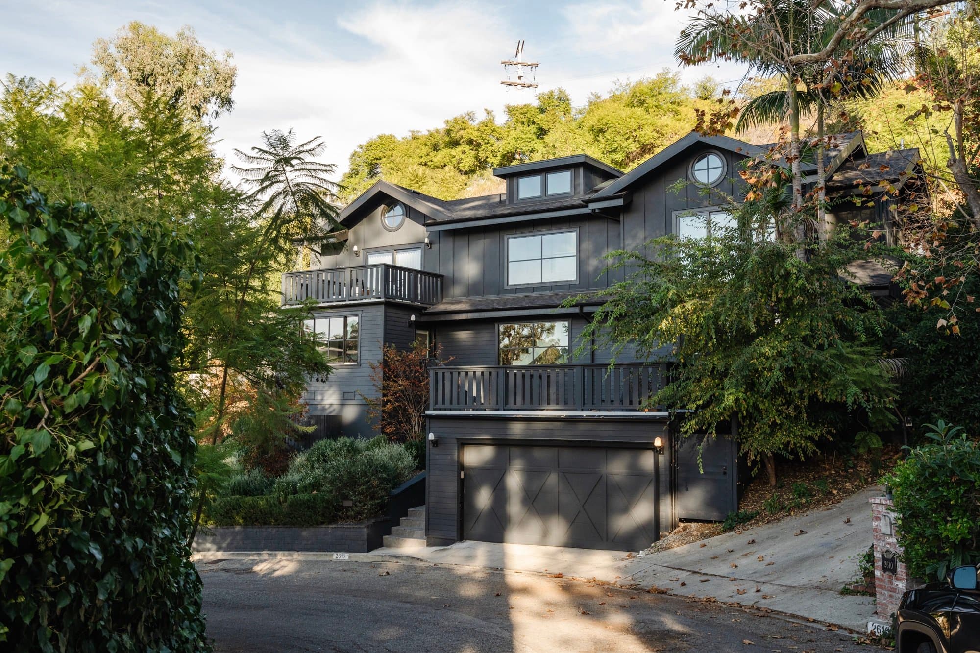 witness locations valente house hollywood hills los angeles exterior dark craftsman hillside garage