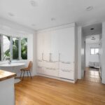 Modern living area featuring glass shower and sleek fixtures